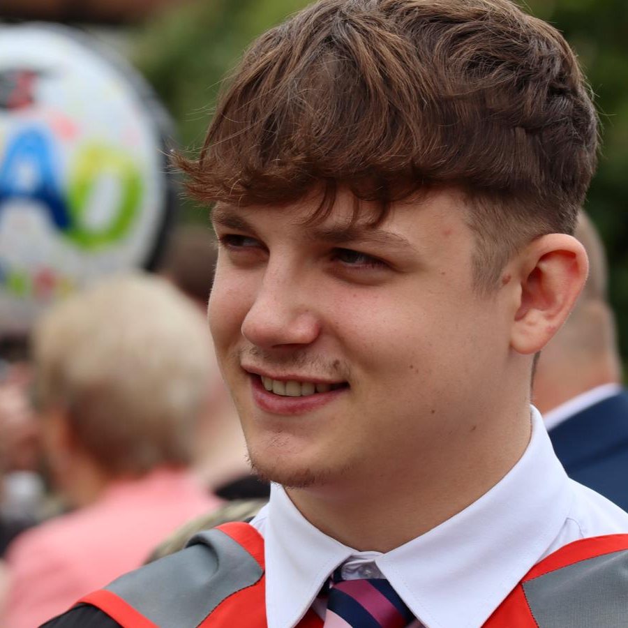 Jack Slaski smiling at his graduation